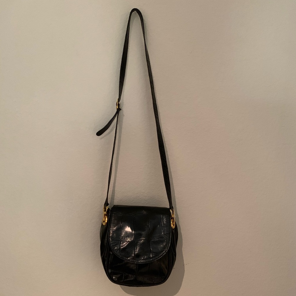 Elegant black genuine leather crossbody bag. Almost new. Holds a lot  gorgeous!